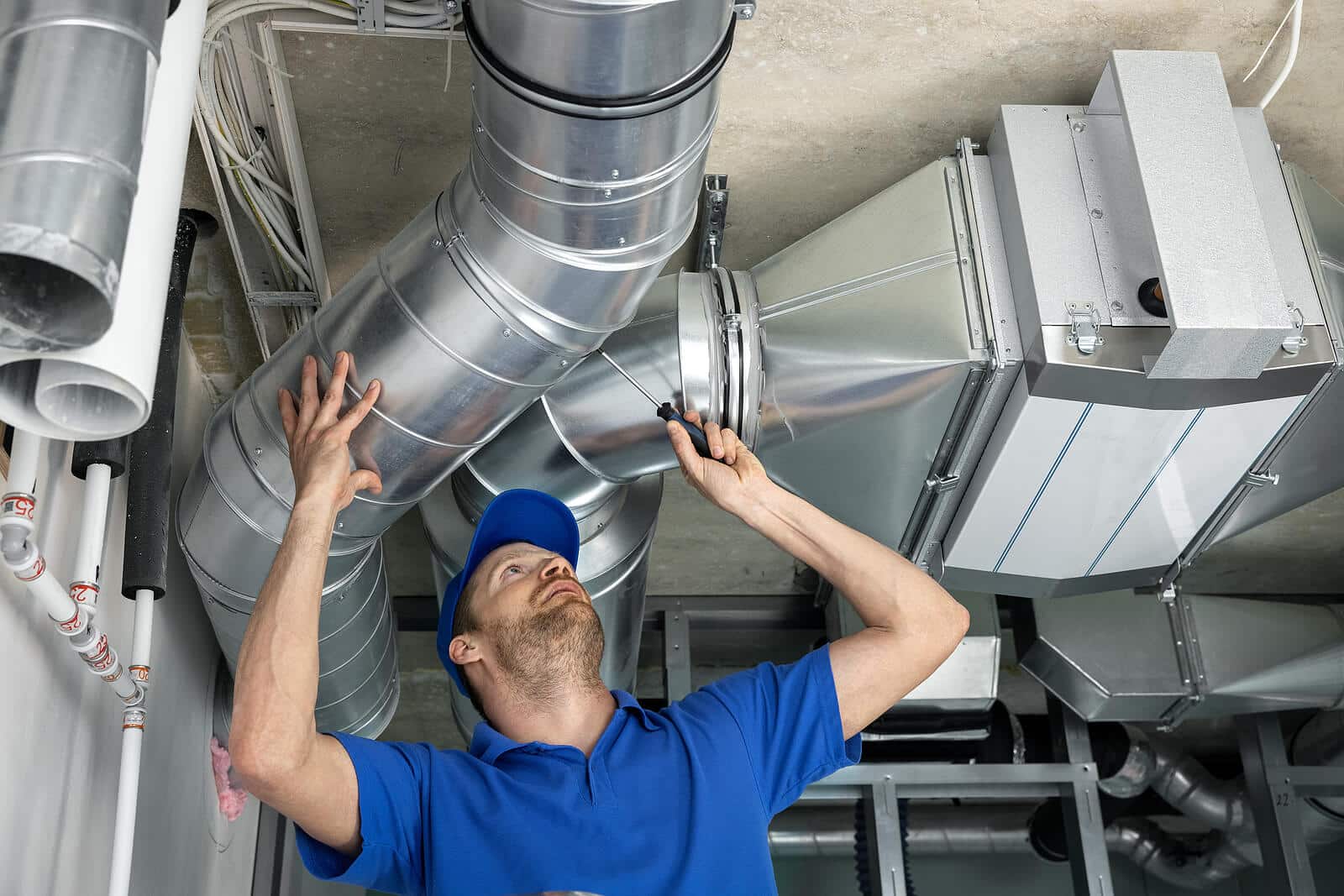 HVAC technician inspecting and repairing air ducts in Walnut