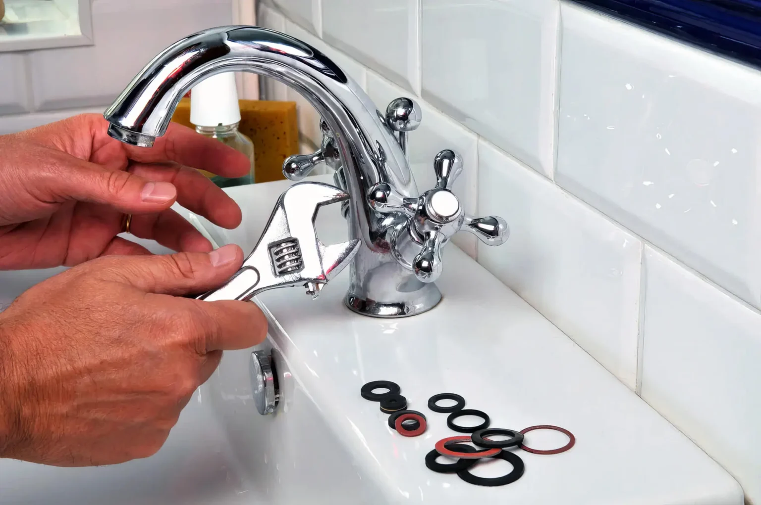 Plumber maintaining a bathroom faucet in Walnut