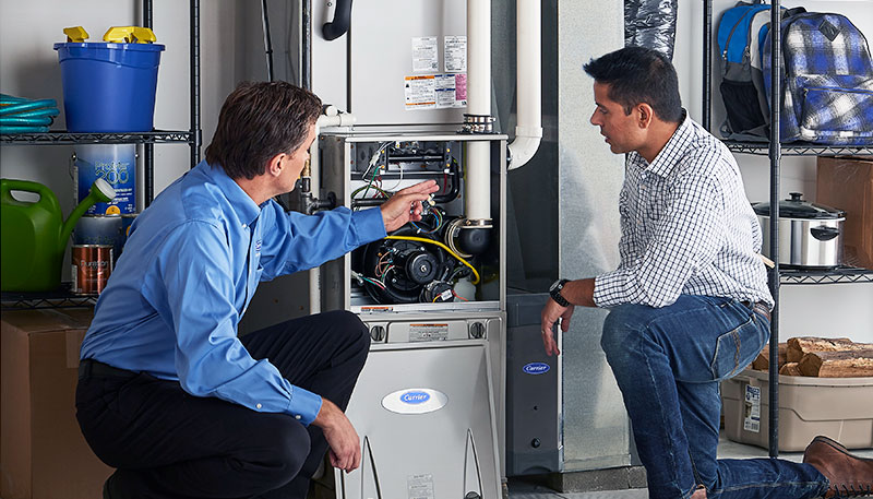 Technician evaluating a furnace for repair or replacement in Walnut