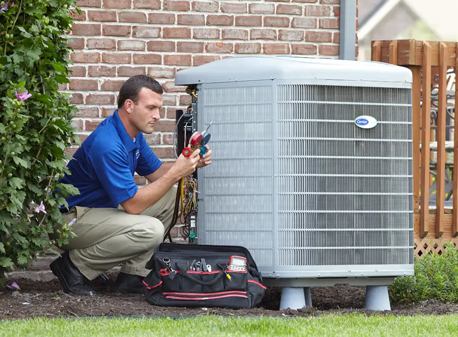 HVAC technician inspecting an outdoor AC unit in Walnut