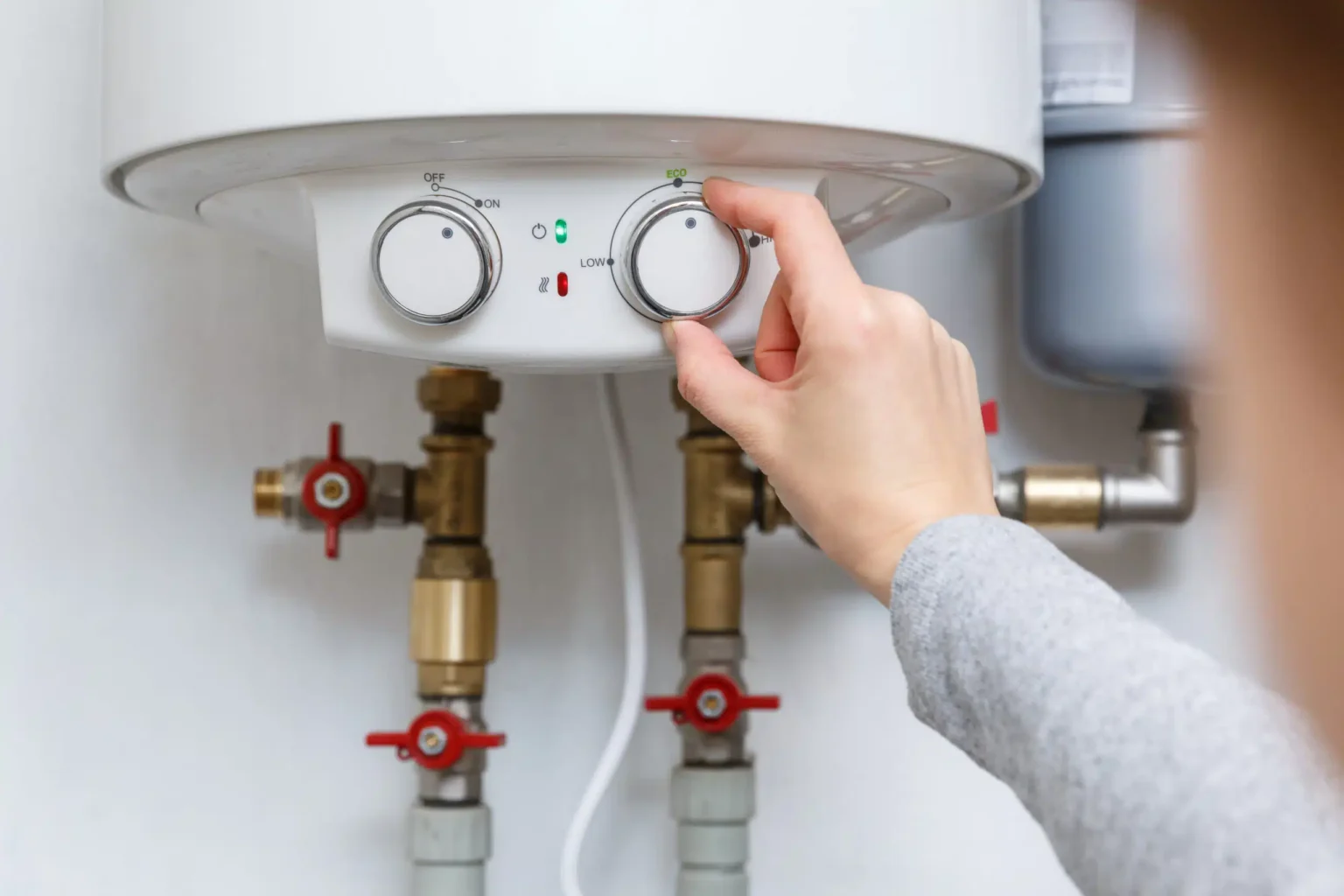 Technician adjusting a water heater in Walnut
